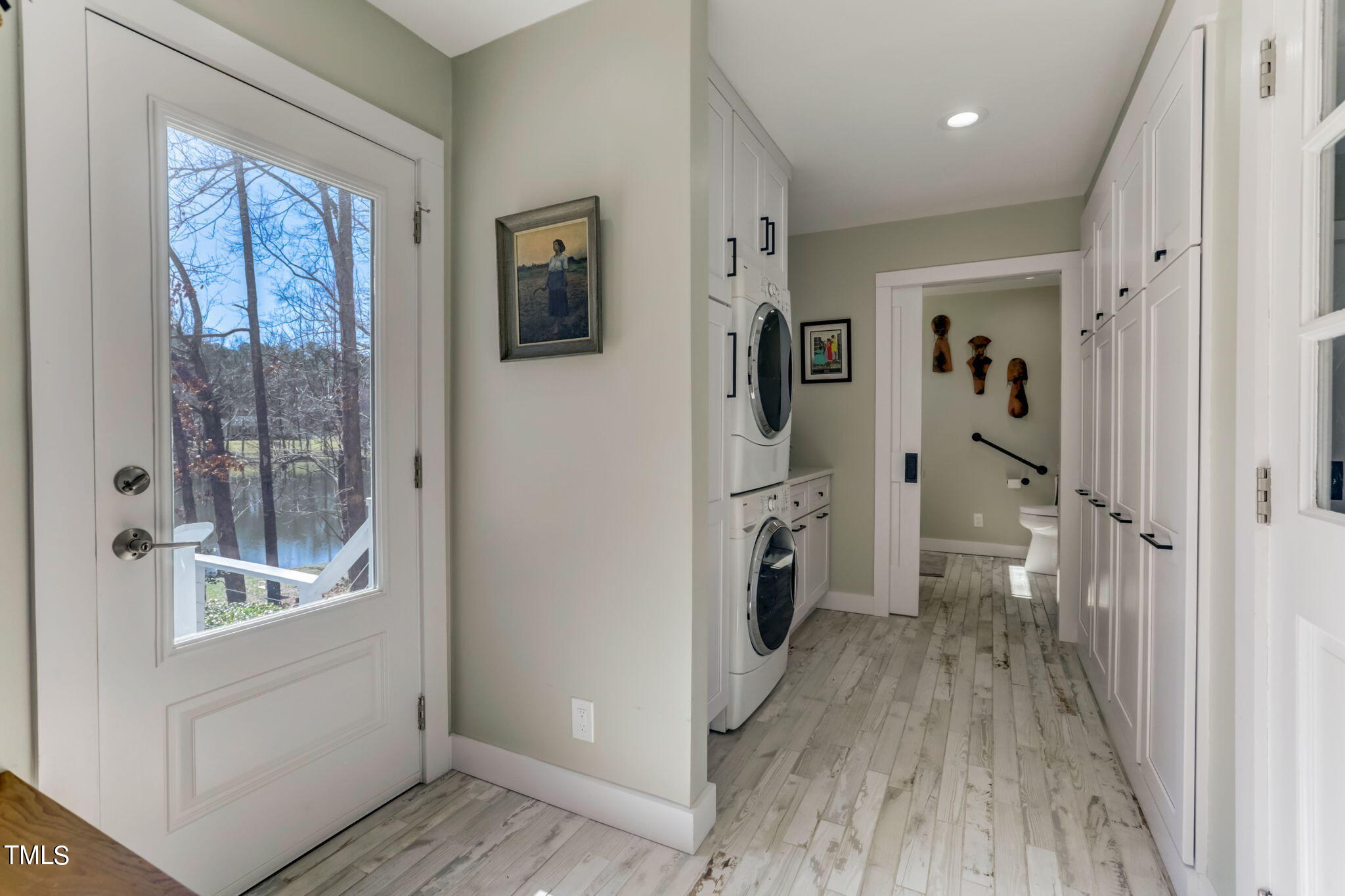 11601 Rutledge Bay Road Raleigh, NC 27614 - Photo 17 of 59 a view of a hallway with wooden floor and a living room