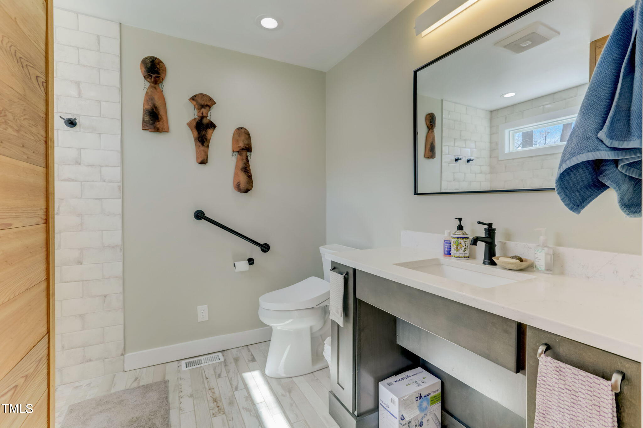 11601 Rutledge Bay Road Raleigh, NC 27614 - Photo 18 of 59 a bathroom with a sink a toilet and shower