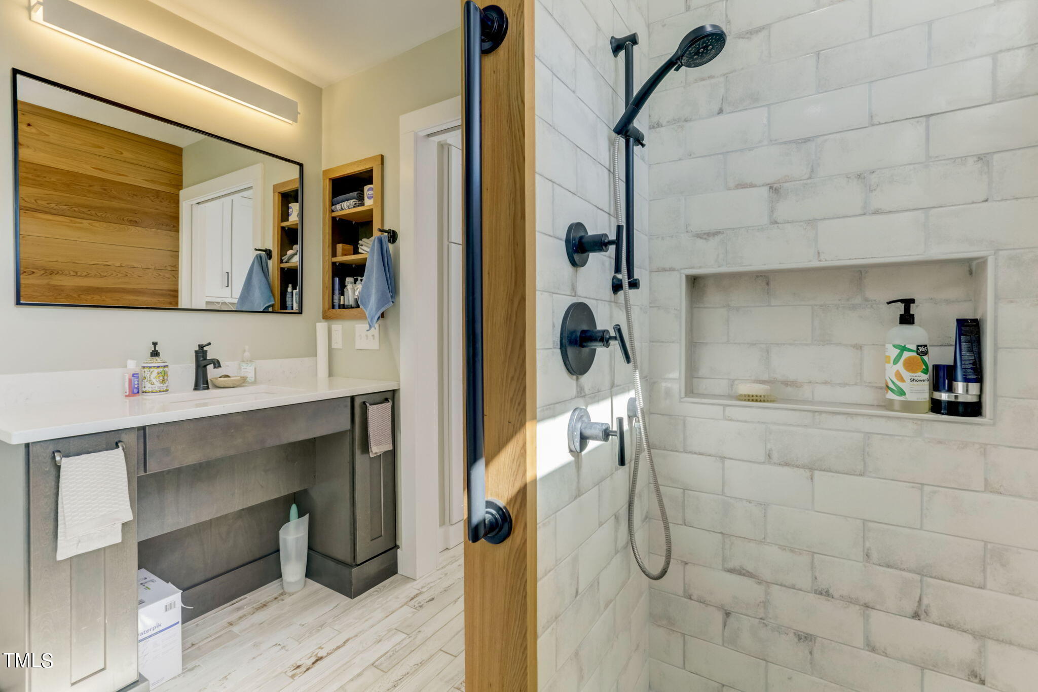 11601 Rutledge Bay Road Raleigh, NC 27614 - Photo 19 of 59 a bathroom with a sink and mirror