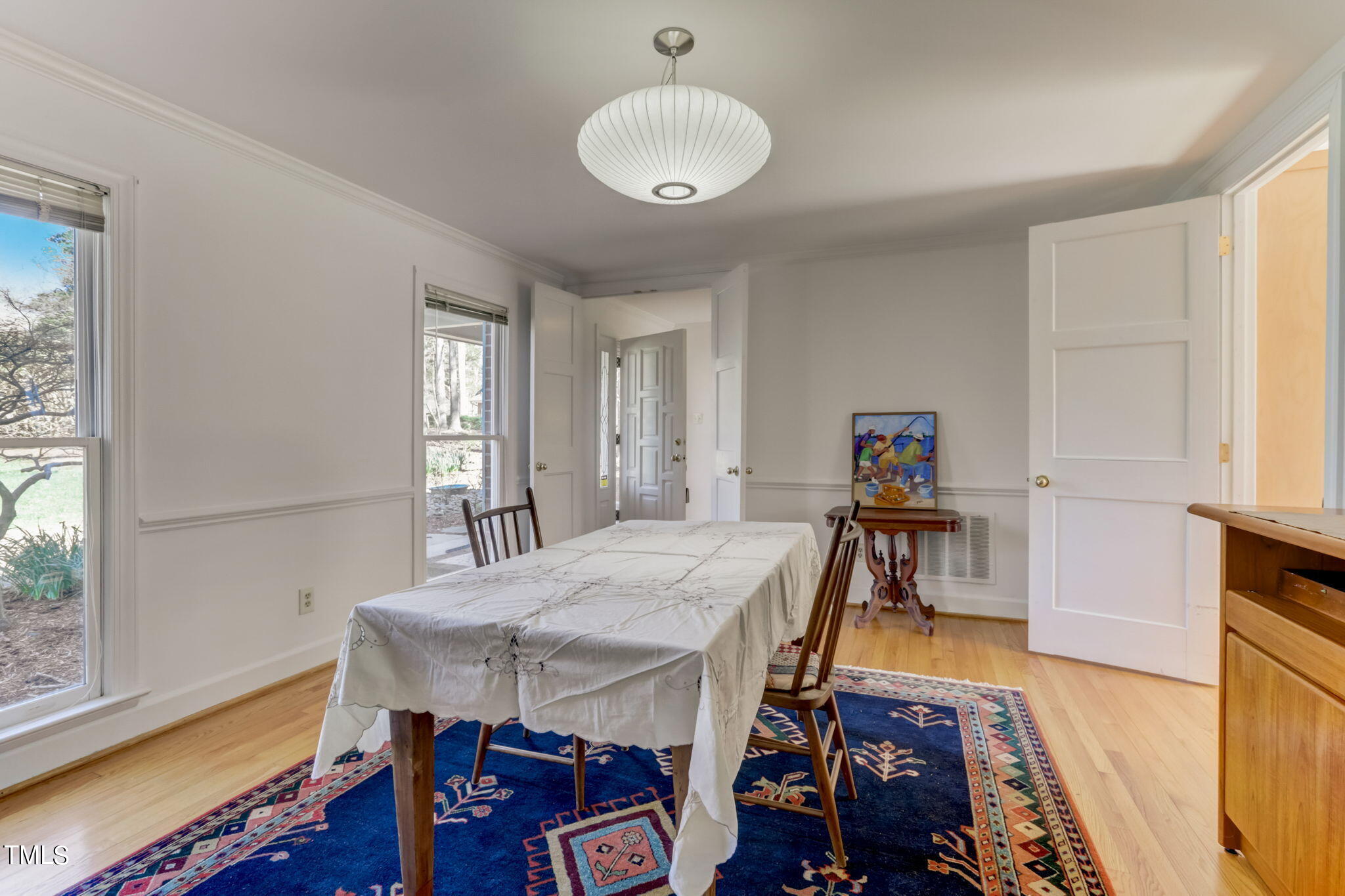 11601 Rutledge Bay Road Raleigh, NC 27614 - Photo 20 of 59 a view of a dining room with furniture and wooden floor