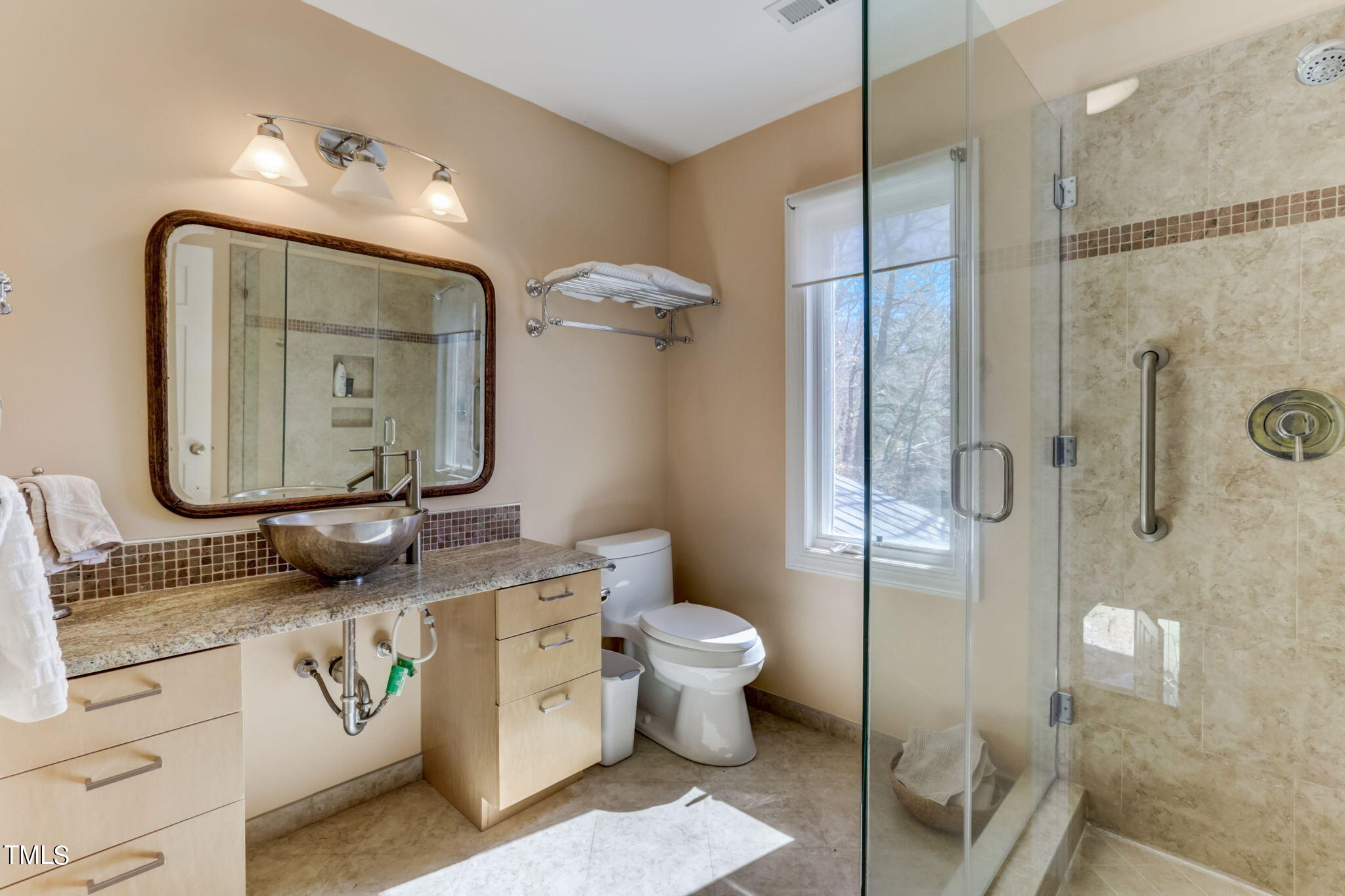 11601 Rutledge Bay Road Raleigh, NC 27614 - Photo 30 of 59 a bathroom with a toilet sink and mirror