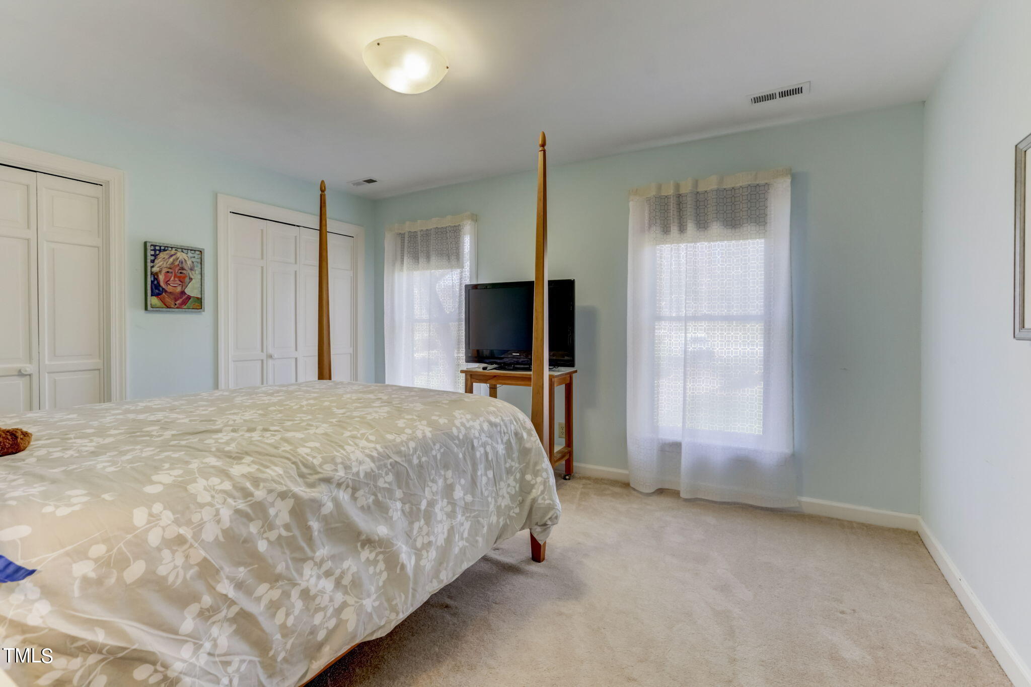 11601 Rutledge Bay Road Raleigh, NC 27614 - Photo 32 of 59 a bed sitting in a spacious bedroom next to a window