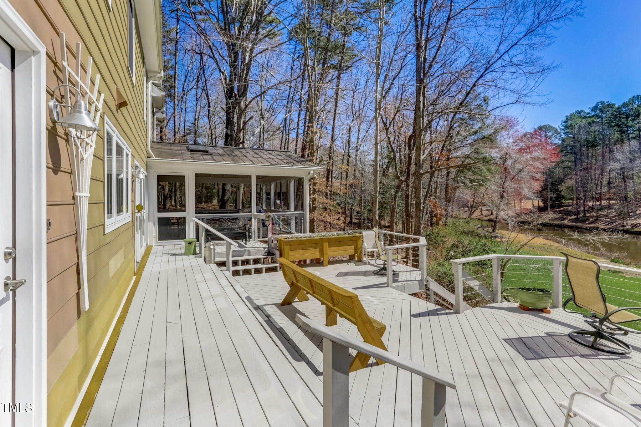 11601 Rutledge Bay Road Raleigh, NC 27614 - Photo 41 of 59 a view of a patio with chairs and wooden floor