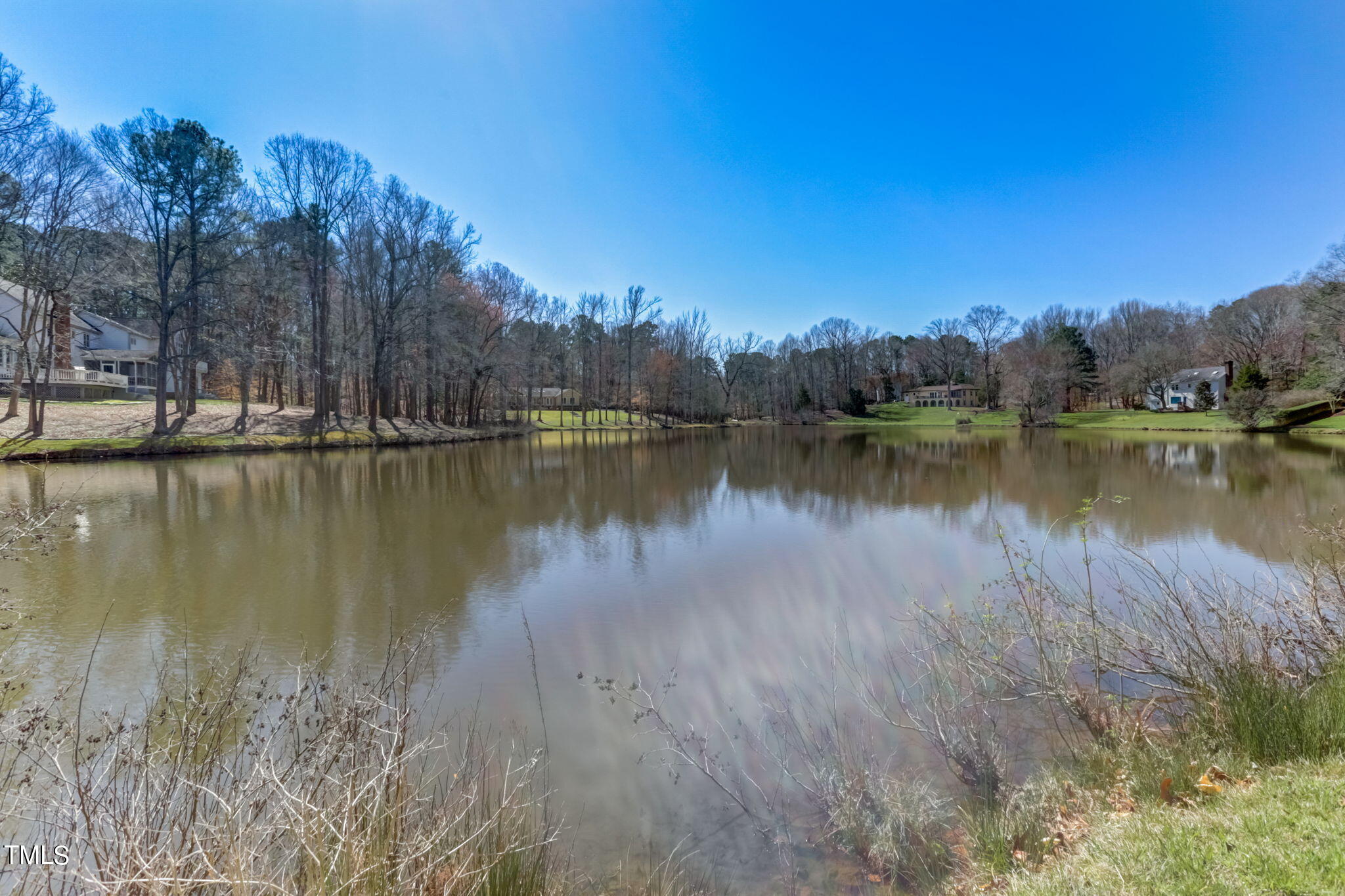 11601 Rutledge Bay Road Raleigh, NC 27614 - Photo 51 of 59 a view of a lake with houses in the back