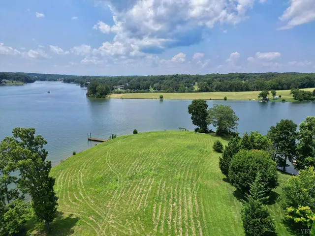 a view of a lake with houses in the back
