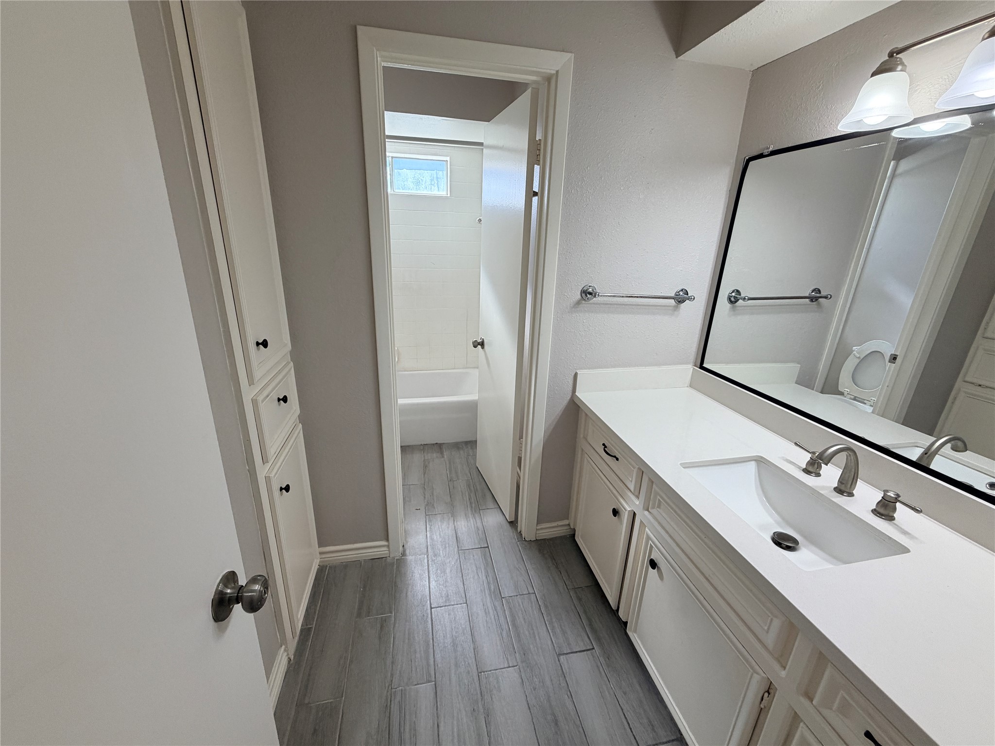 1607 Chestnut Ridge Road Houston, TX 77339 - Photo 18 of 31 a bathroom with a double vanity sink and mirror with shower