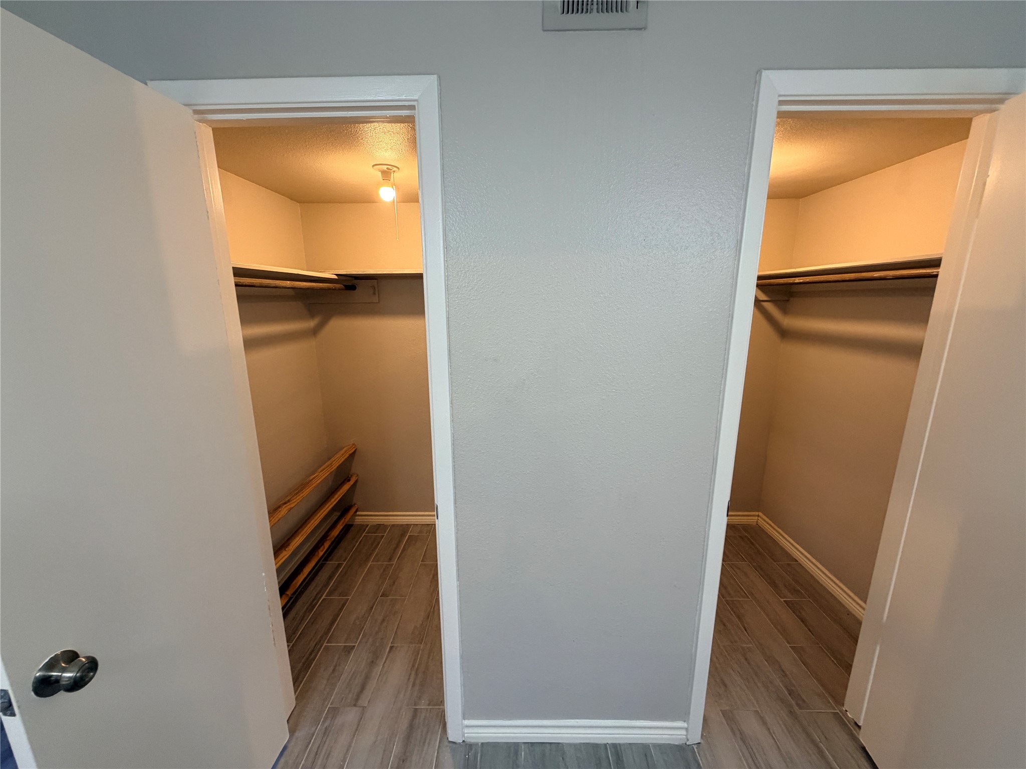 1607 Chestnut Ridge Road Houston, TX 77339 - Photo 22 of 31 a view of walk in closet with wooden floor