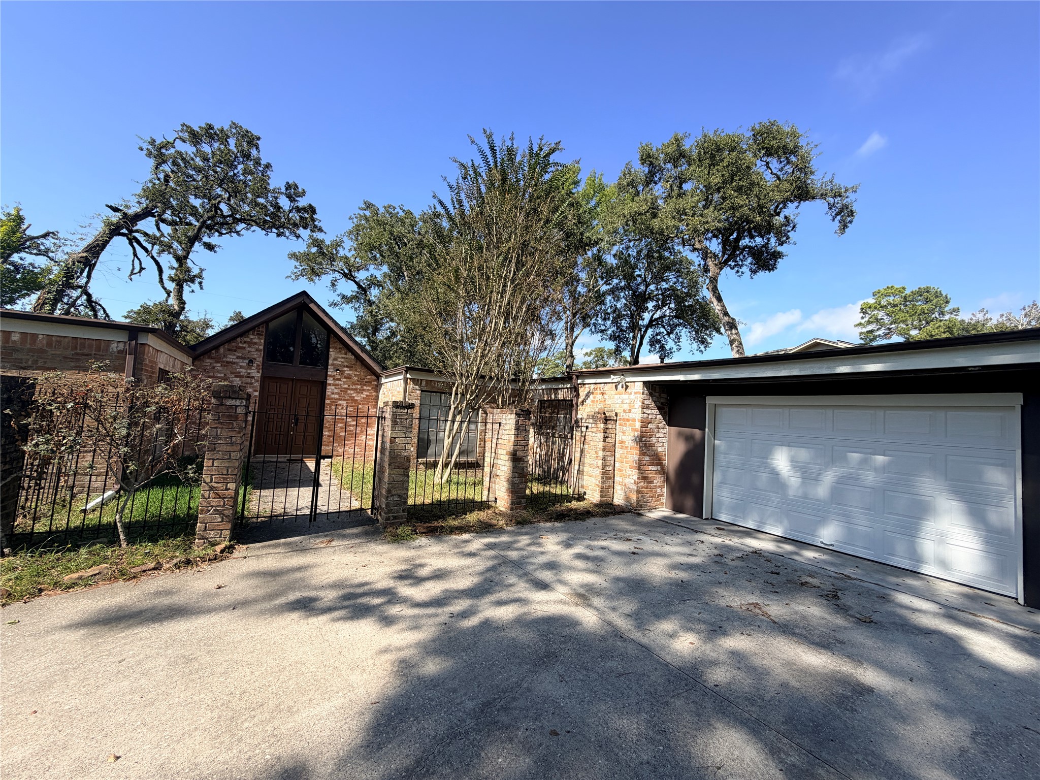 1607 Chestnut Ridge Road Houston, TX 77339 - Photo 26 of 31 a view of a house with a yard