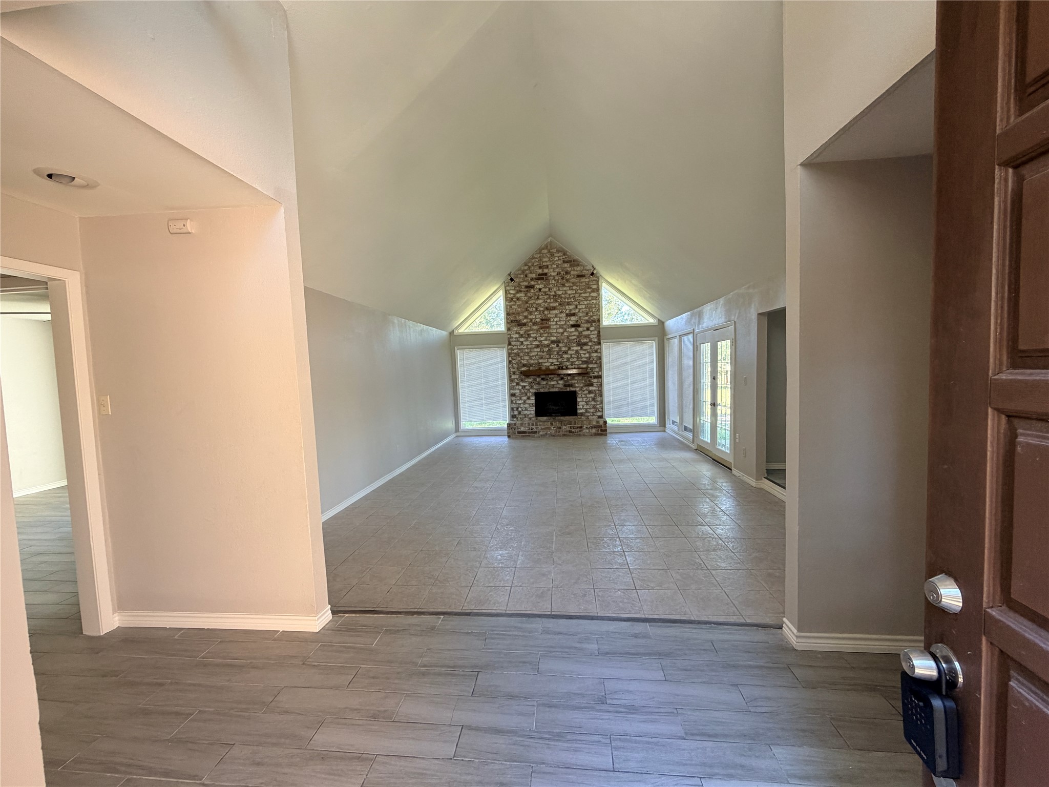 1607 Chestnut Ridge Road Houston, TX 77339 - Photo 4 of 31 a view of entryway and hall with wooden floor