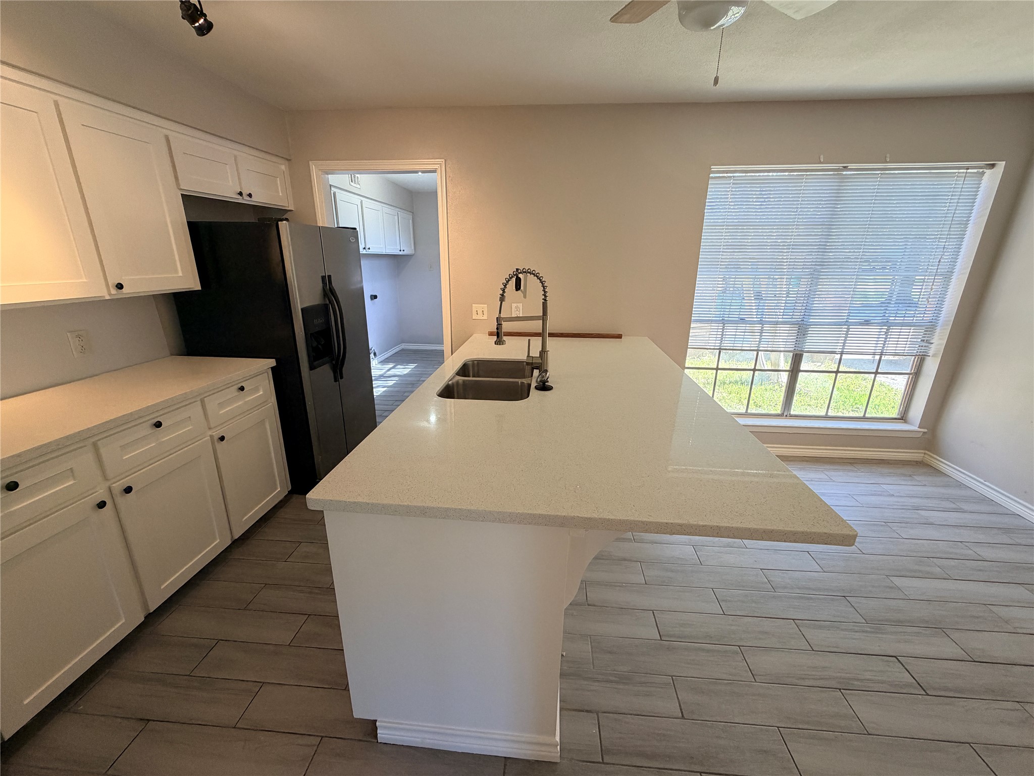 1607 Chestnut Ridge Road Houston, TX 77339 - Photo 10 of 31 a kitchen with stainless steel appliances a refrigerator sink and wooden floor