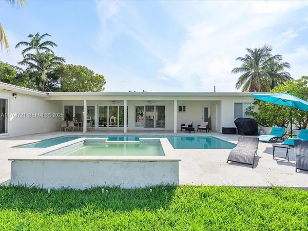 a view of a swimming pool with a patio