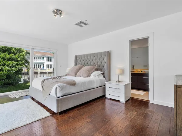 a bedroom with a bed and a view of bedroom