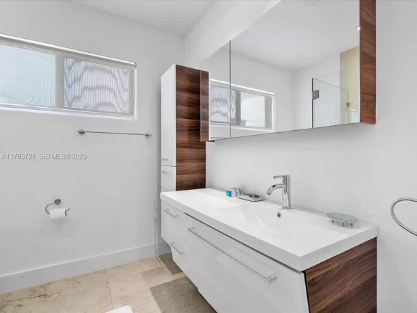 a utility room with cabinets