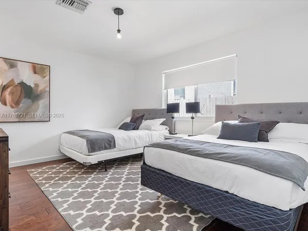 a bedroom with a bed and a couch