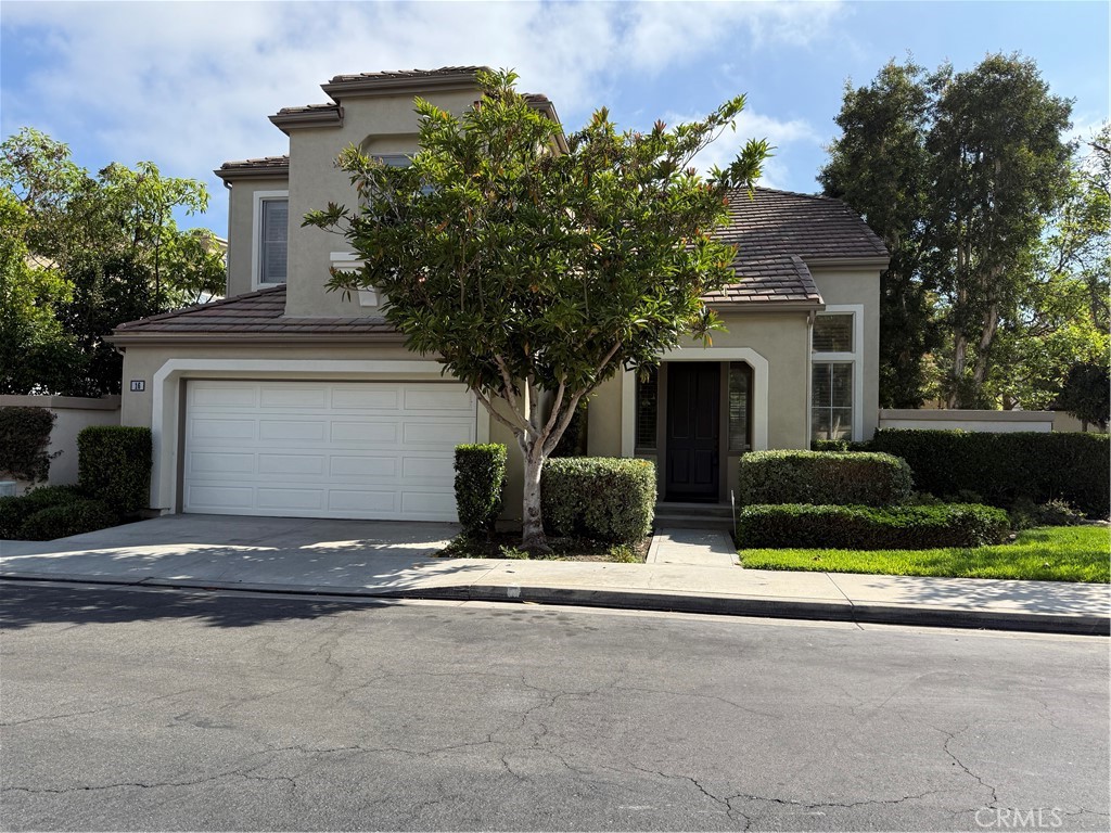 16 Del Ventura Irvine, CA 92606 - Photo 1 of 15 a front view of a house with yard and garage