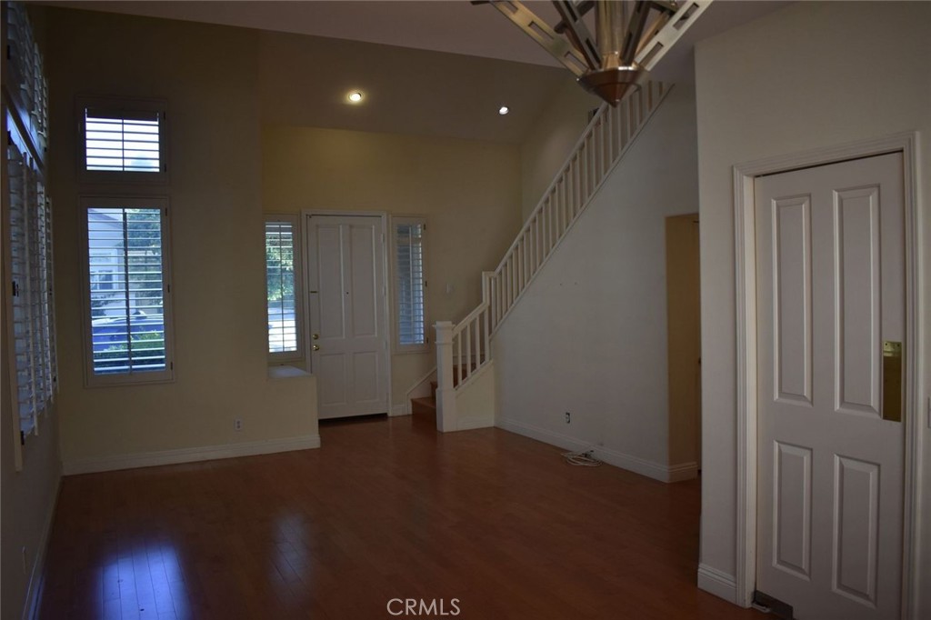 16 Del Ventura Irvine, CA 92606 - Photo 3 of 15 a view of an entryway with wooden floor and windows