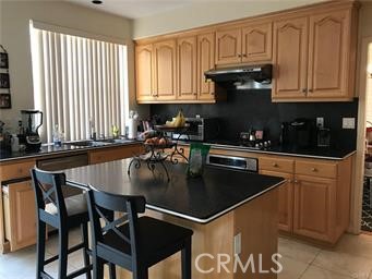 16 Del Ventura Irvine, CA 92606 - Photo 5 of 15 a kitchen with stainless steel appliances granite countertop a stove a sink dishwasher and cabinets with wooden floor