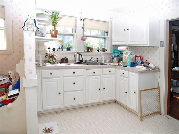 22 Arapahoe Road Newton, MA 02465 - Photo 7 of 13 a kitchen with white cabinets and window