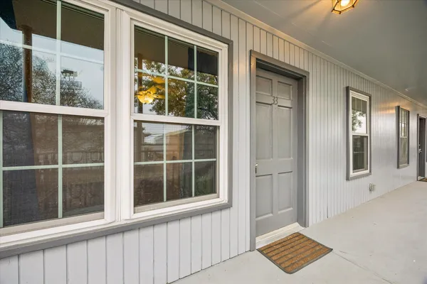 a view of a door and a window