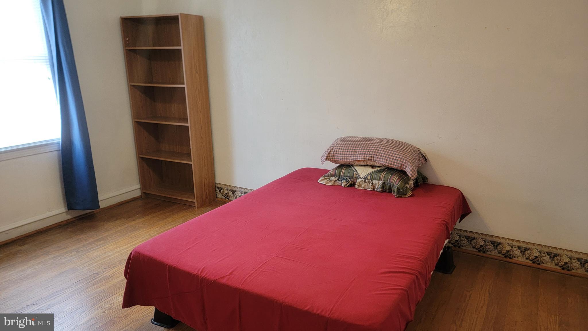 6024 Reach Street Philadelphia, PA 19111 - Photo 17 of 18 a bedroom with a bed and a closet