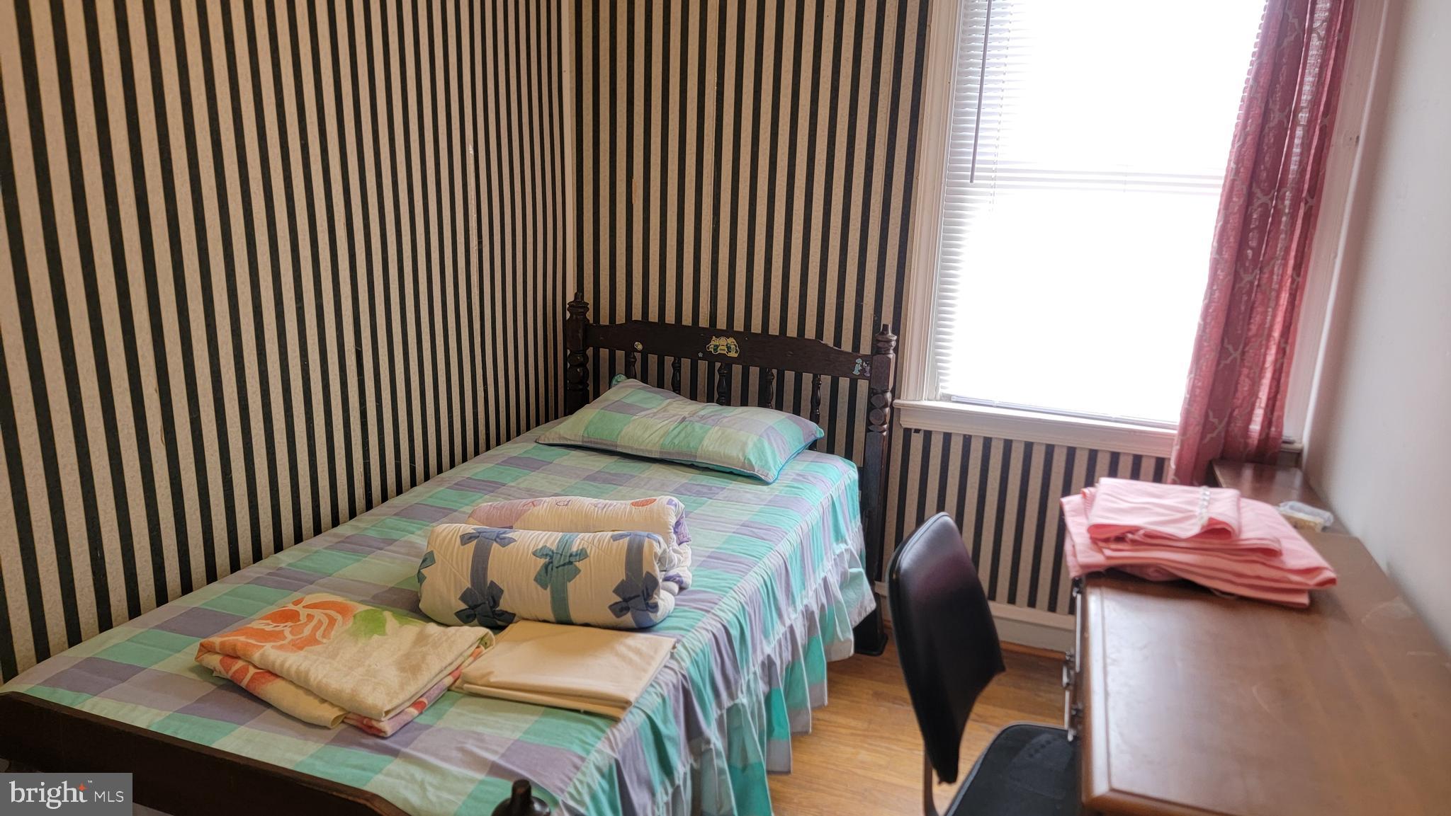 6024 Reach Street Philadelphia, PA 19111 - Photo 18 of 18 a bedroom with a bed and windows