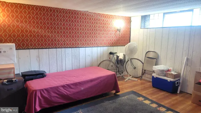 a bedroom with a bed and a table