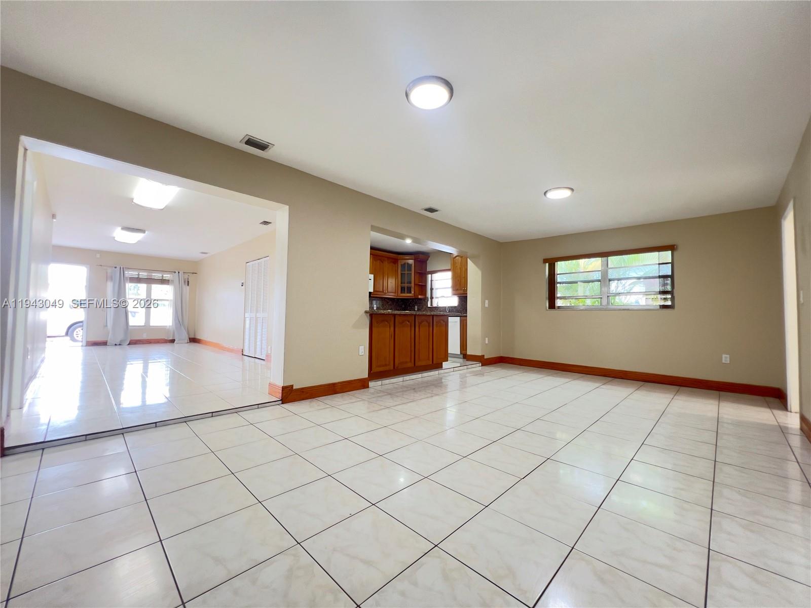 2761 Southwest 33rd Court, Unit A Miami, FL 33133 - Photo 21 of 22 a view of an empty room and a window