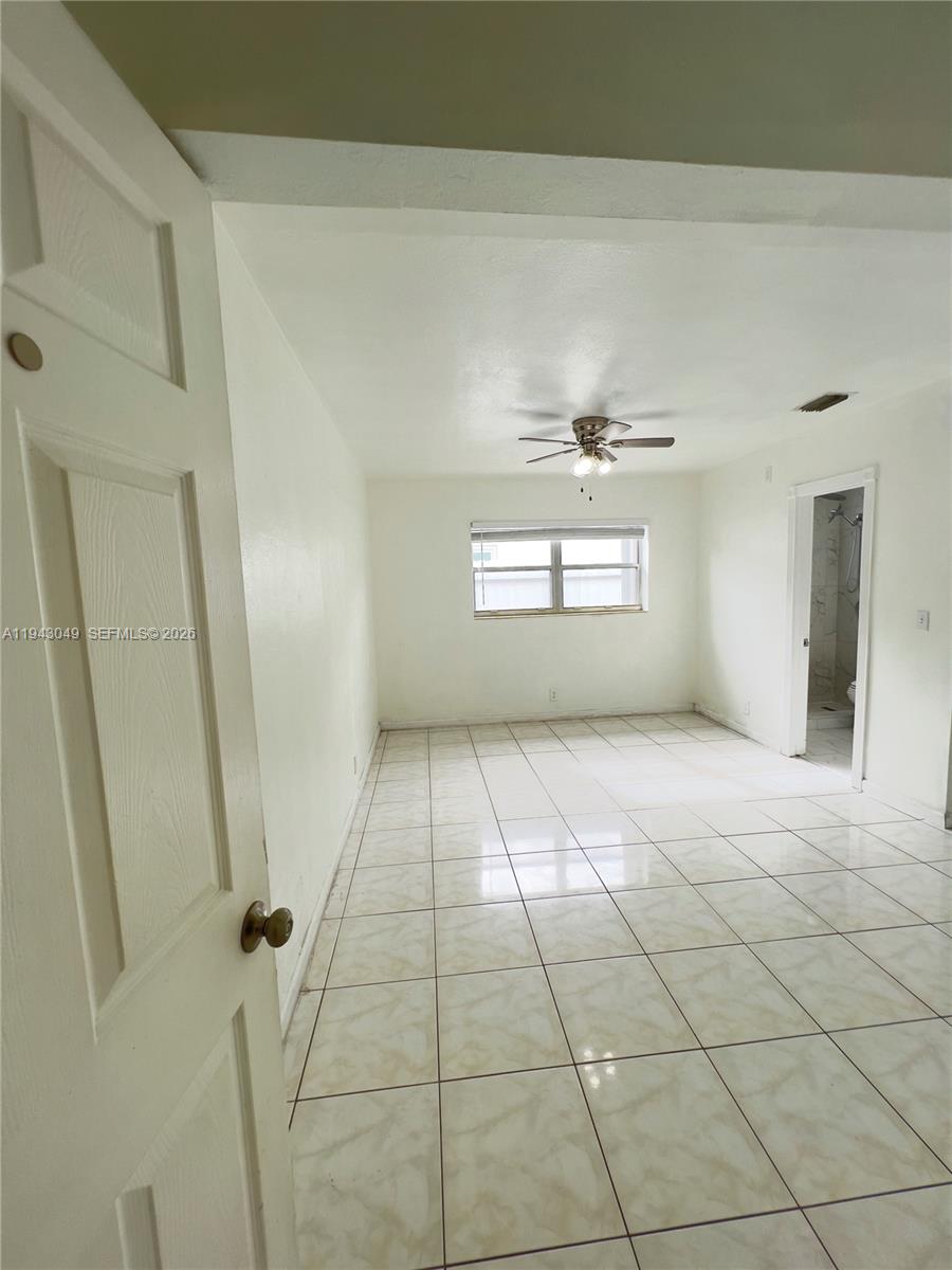2761 Southwest 33rd Court, Unit A Miami, FL 33133 - Photo 6 of 22 a view of an empty room and window