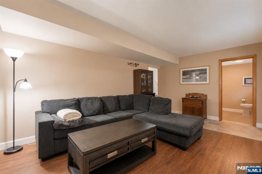 55 Marcia Road Ringwood, NJ 07456 - Photo 25 of 42 a living room with furniture and wooden floor