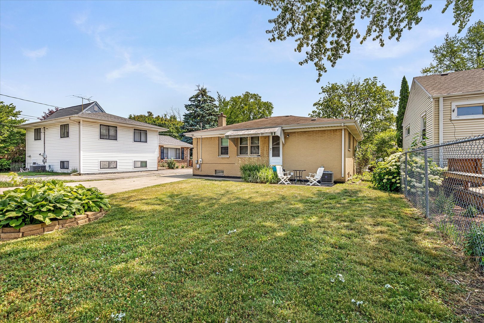 682 Spring Road Elmhurst, IL 60126 - Photo 22 of 28 a front view of a house with a garden