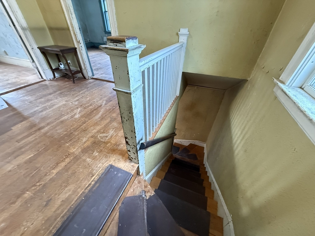 18 Spring Street Lexington, MA 02421 - Photo 17 of 21 a view of stairs and wooden floor