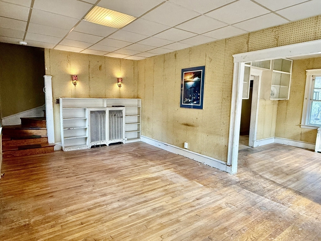 18 Spring Street Lexington, MA 02421 - Photo 5 of 21 a view of a room with wooden floor and brick walls