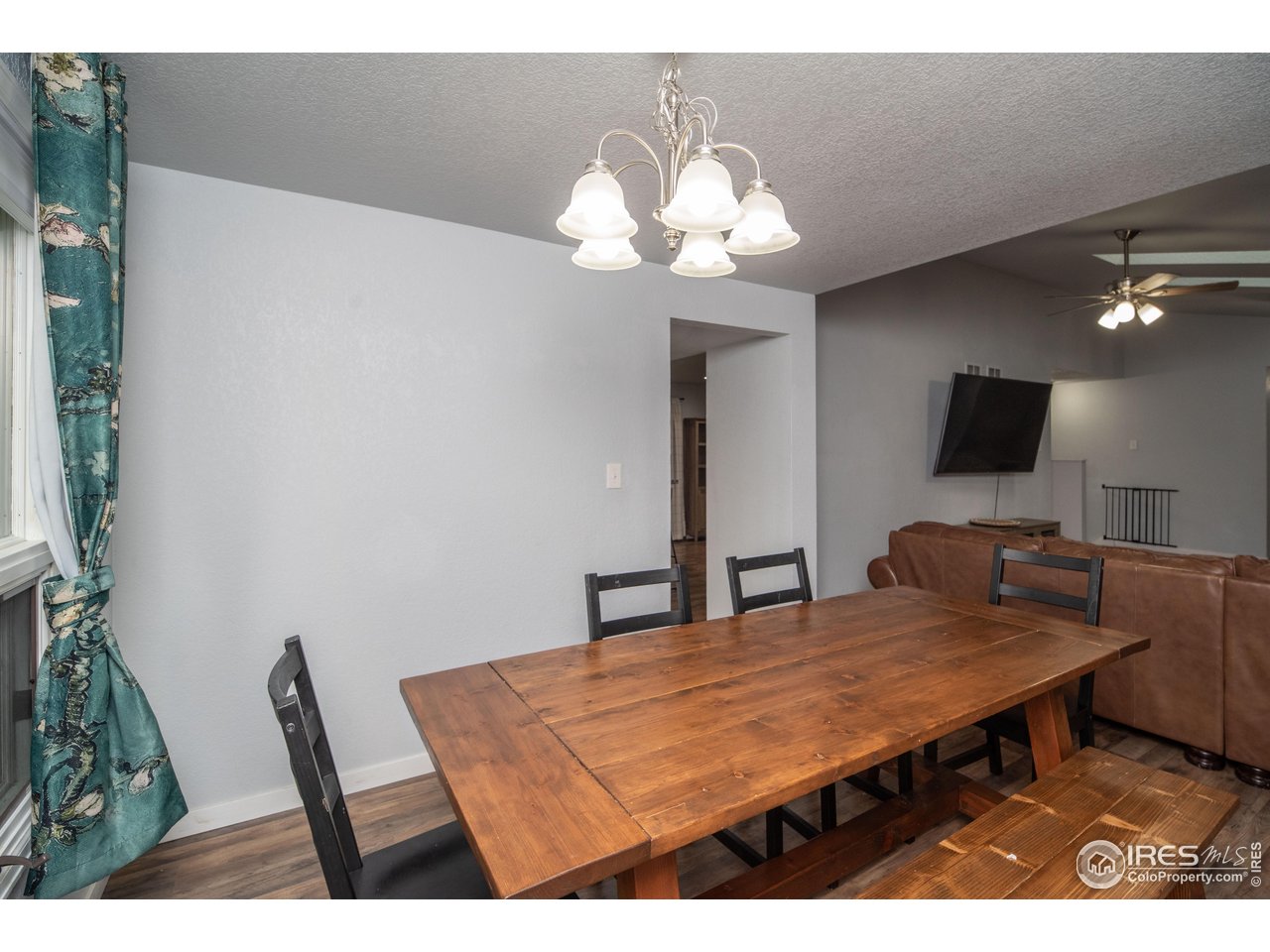 10879 West 65th Way Arvada, CO 80004 - Photo 13 of 39 a dining room with a table and chairs