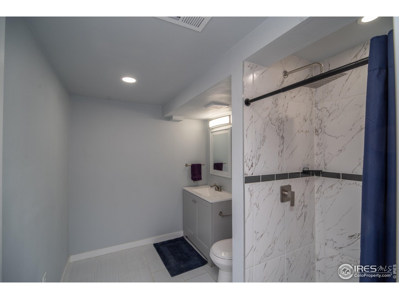 10879 West 65th Way Arvada, CO 80004 - Photo 15 of 39 a bathroom with a sink and mirror
