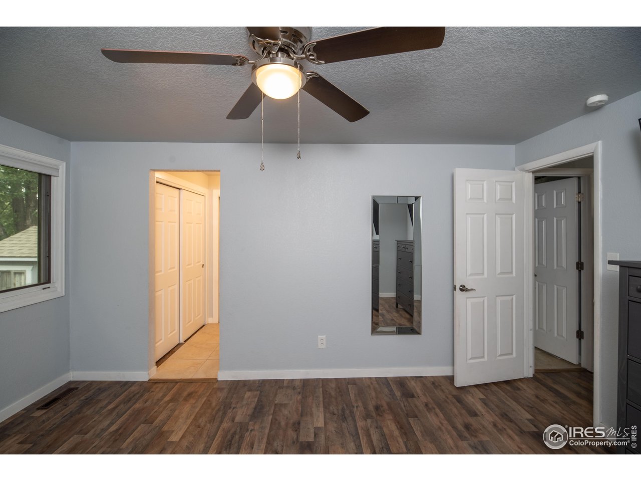 10879 West 65th Way Arvada, CO 80004 - Photo 21 of 39 a view interior of a house wooden floor an entryway