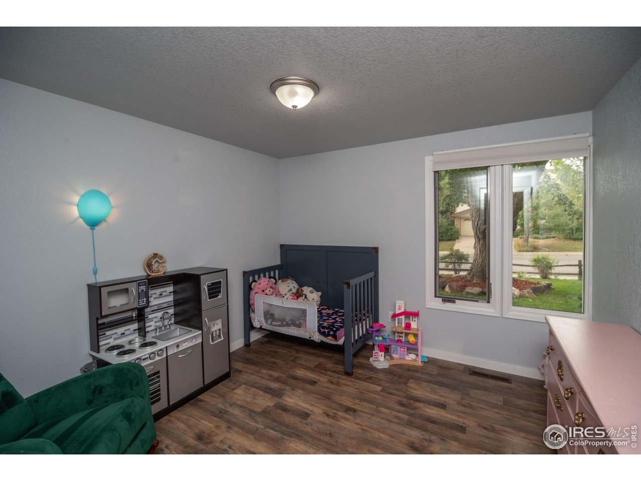 10879 West 65th Way Arvada, CO 80004 - Photo 29 of 39 a living room with furniture and a window