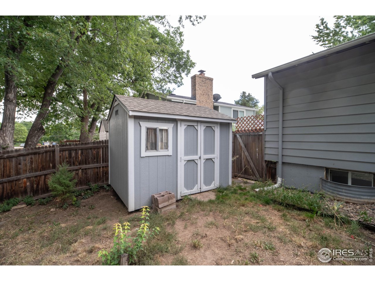 10879 West 65th Way Arvada, CO 80004 - Photo 37 of 39 a view of a house with a yard
