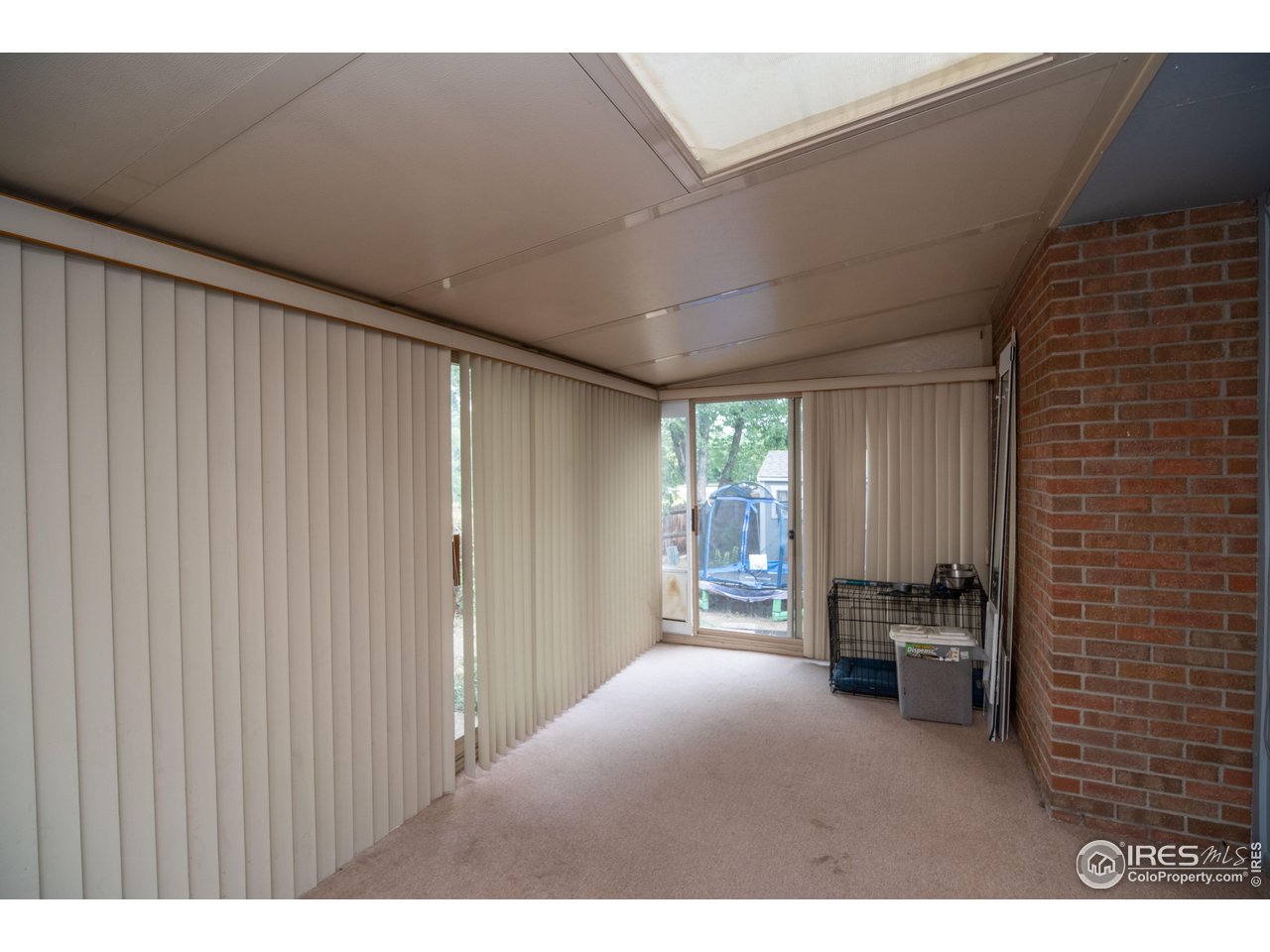 10879 West 65th Way Arvada, CO 80004 - Photo 38 of 39 a living room with furniture and large windows
