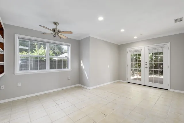 a view of an empty room with a window