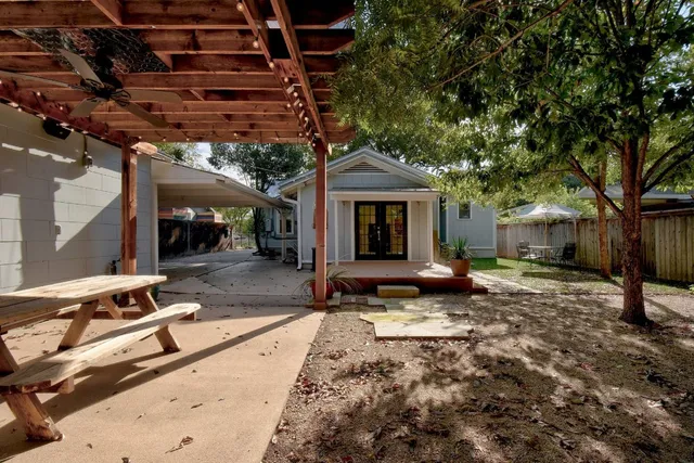 a view of a backyard with a patio