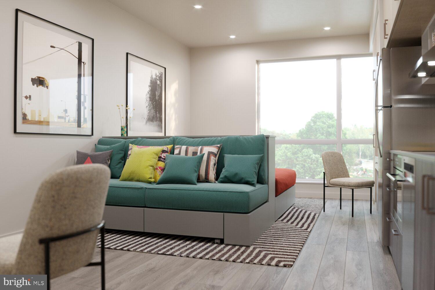 1314 Spring Garden Street, Unit 501 Philadelphia, PA 19123 - Photo 6 of 26 a living room with furniture and a large window