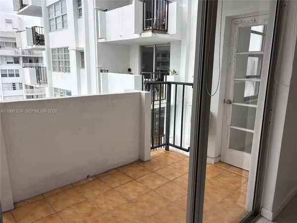 a view of a hallway with seating area