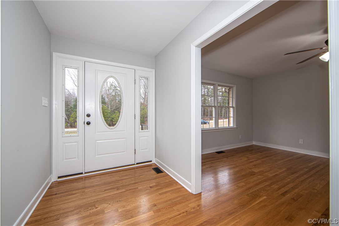 8941 Crumps Mill Road Quinton, VA 23141 - Photo 3 of 34 The foyer is open and inviting with wood floors and spacious entry.
