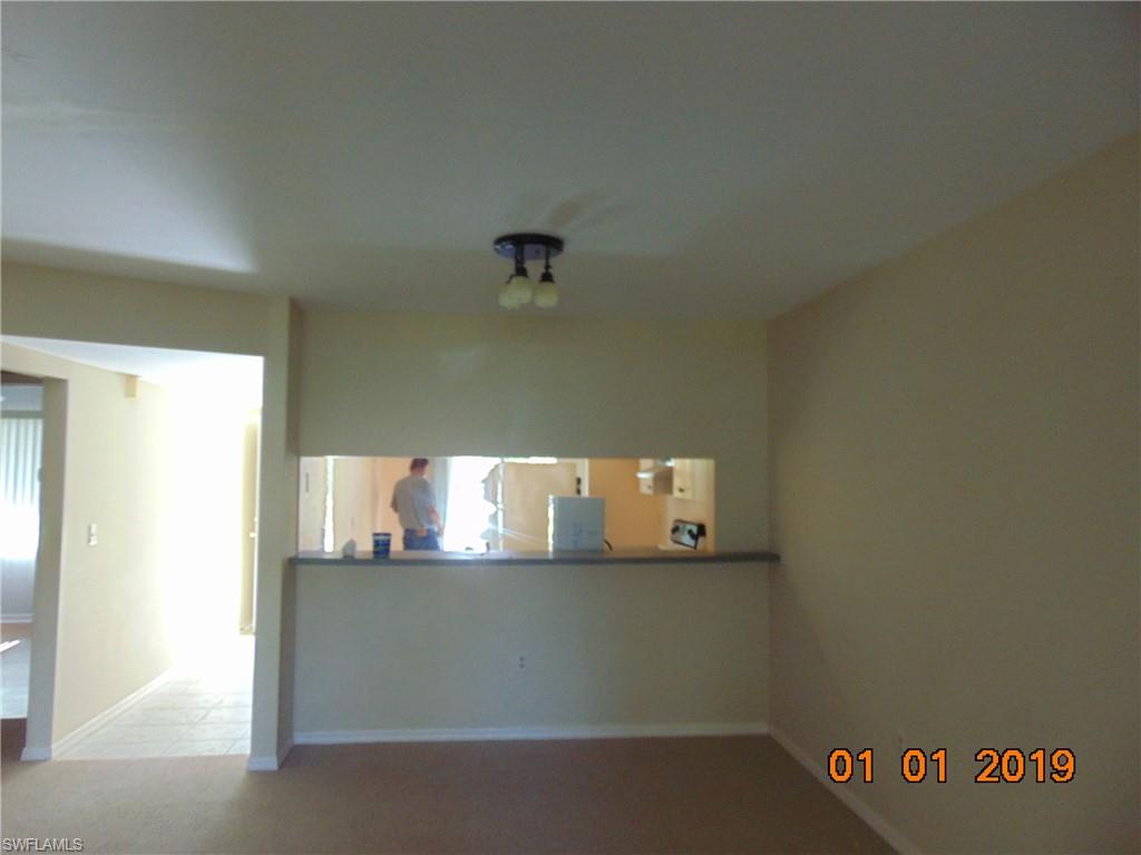 5685 Whitaker Road, Unit C102 Naples, FL 34112 - Photo 10 of 10 a view of a book shelf