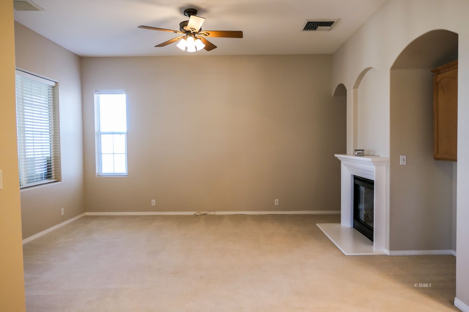 120 West Franklin Avenue Ridgecrest, CA 93555 - Photo 6 of 49 an empty room with windows and fireplace