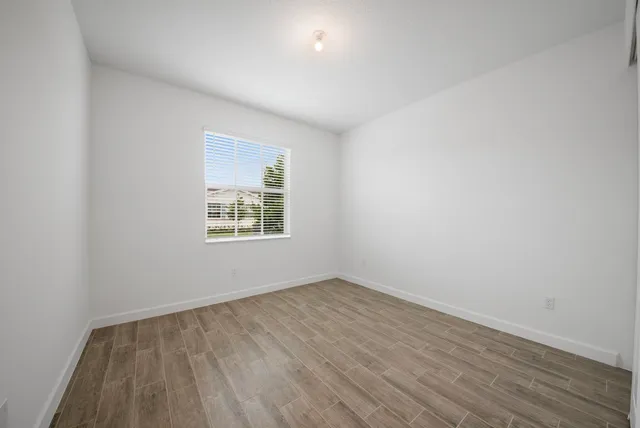 a bathroom with a shower and a glass door