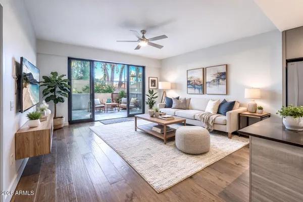 a living room with furniture and a large window