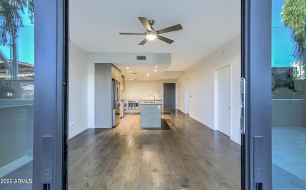 a view of a living room with wooden floor