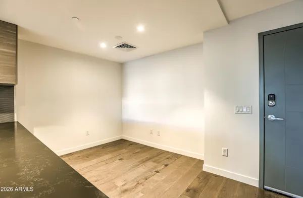 an empty room with wooden floor