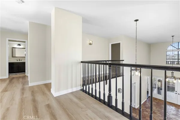 a view of hallway with wooden floor